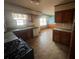 Spacious kitchen with wood cabinets, neutral countertops and gas stove at 3415 Spring Valley Blvd, Atlanta, GA 30349
