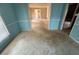 Inviting living room with neutral colored carpet and trim at 3415 Spring Valley Blvd, Atlanta, GA 30349