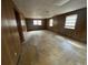 Large room with wood paneling and windows at 3415 Spring Valley Blvd, Atlanta, GA 30349