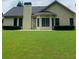 Large, flat backyard with a concrete patio, great for outdoor entertaining and recreation at 518 Oriole Farm Trl, Canton, GA 30114
