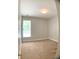 Carpeted bedroom with natural light from the window at 518 Oriole Farm Trl, Canton, GA 30114