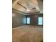 Bedroom with neutral walls and tray ceiling at 518 Oriole Farm Trl, Canton, GA 30114