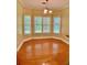 Bright breakfast nook with wood floors and views of the green backyard at 518 Oriole Farm Trl, Canton, GA 30114
