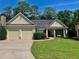 Charming ranch home with a well-manicured lawn, covered porch, and a two-car garage at 518 Oriole Farm Trl, Canton, GA 30114