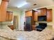 Kitchen features stainless steel appliances and granite countertops and breakfast bar at 518 Oriole Farm Trl, Canton, GA 30114