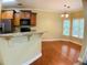 Kitchen with granite countertops, stainless steel refrigerator, and eat-in breakfast nook at 518 Oriole Farm Trl, Canton, GA 30114