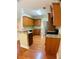 Well-equipped kitchen with wood cabinetry, granite countertops, and stainless steel appliances at 518 Oriole Farm Trl, Canton, GA 30114