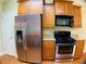 Kitchen with stainless steel refrigerator and oven range with granite countertops at 518 Oriole Farm Trl, Canton, GA 30114