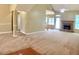 Spacious living room with carpet, fireplace, and access to the backyard at 518 Oriole Farm Trl, Canton, GA 30114