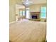 Living room with stone fireplace and views to breakfast nook and kitchen at 518 Oriole Farm Trl, Canton, GA 30114