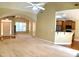 Open concept living room with kitchen, fireplace, and access to the backyard at 518 Oriole Farm Trl, Canton, GA 30114