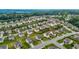 An aerial view of a well-maintained neighborhood with green lawns at 1494 Weeping Tree Cir, Auburn, GA 30548
