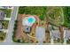 Aerial view of a community pool, clubhouse, and playground at 1494 Weeping Tree Cir, Auburn, GA 30548