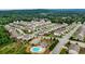 Aerial view of a new home community with a pool and clubhouse at 1494 Weeping Tree Cir, Auburn, GA 30548