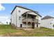 Backyard with a two-story home and a wooden porch and room to roam at 1494 Weeping Tree Cir, Auburn, GA 30548