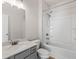 Bright bathroom with combination shower-bathtub, toilet, and single vanity sink at 1494 Weeping Tree Cir, Auburn, GA 30548