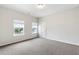 Neutral bedroom with natural light and gray carpet flooring at 1494 Weeping Tree Cir, Auburn, GA 30548