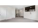 Spacious bonus room features neutral walls, gray carpet, and a large mounted television at 1494 Weeping Tree Cir, Auburn, GA 30548