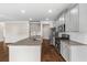 Kitchen featuring stone countertops, stainless steel appliances and gray cabinets at 1494 Weeping Tree Cir, Auburn, GA 30548