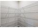 A walk-in pantry with metal racks in a closet at 1494 Weeping Tree Cir, Auburn, GA 30548