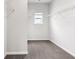 Walk-in closet with neutral walls, gray carpet, a window, and wire shelves at 1494 Weeping Tree Cir, Auburn, GA 30548