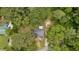 Aerial view of a home nestled among mature trees, offering privacy and a connection with nature at 5143 3Rd St, Morrow, GA 30260