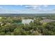 Aerial view showcasing a serene lake and surrounding lush greenery, a true neighborhood oasis at 5143 3Rd St, Morrow, GA 30260