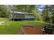 Spacious backyard with a well-maintained lawn, a deck, and mature trees at 5143 3Rd St, Morrow, GA 30260
