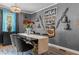 Stylish dining area with wine storage, a modern light fixture, and chic decor creating a sophisticated ambiance at 5143 3Rd St, Morrow, GA 30260