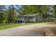 Charming home featuring a well-manicured lawn and a welcoming entrance at 5143 3Rd St, Morrow, GA 30260