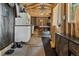 Versatile game room with exposed beams, cabinets, and entertainment setup at 5143 3Rd St, Morrow, GA 30260