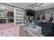 Open living space with a view to the kitchen, modern decor, and a contemporary sliding barn door at 5143 3Rd St, Morrow, GA 30260