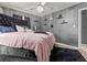 Elegant main bedroom with plush bedding, sophisticated decor, and ample natural light creating a serene retreat at 5143 3Rd St, Morrow, GA 30260