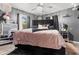 Well-appointed main bedroom featuring stylish furnishings, modern decor, and plenty of space for relaxation at 5143 3Rd St, Morrow, GA 30260