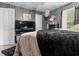 Cozy main bedroom featuring a large bed, modern decor, and plenty of natural light offering a comfortable space at 5143 3Rd St, Morrow, GA 30260