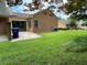 View of the home's backyard with well-maintained lawn and patio at 7123 Woodridge Ln, Union City, GA 30291
