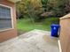 A concrete patio is next to a grassy backyard, with trees in the background at 7123 Woodridge Ln, Union City, GA 30291