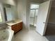 Bathroom showcasing a soaking tub, a vanity, and a separate shower at 7123 Woodridge Ln, Union City, GA 30291