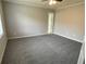 Spacious bedroom featuring plush carpeting, fresh paint, and ample closet space at 7123 Woodridge Ln, Union City, GA 30291