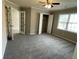 Cozy bedroom featuring plush carpeting, fresh paint, and ample closet space at 7123 Woodridge Ln, Union City, GA 30291