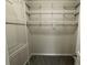 A well-organized walk-in closet with shelving and hanging rods, perfect for storage and organization at 7123 Woodridge Ln, Union City, GA 30291