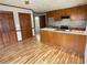 Kitchen featuring an island, stainless steel appliances, and hardwood floors at 7123 Woodridge Ln, Union City, GA 30291