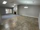 Open living room featuring new flooring, a cozy fireplace, skylight and a ceiling fan at 7123 Woodridge Ln, Union City, GA 30291