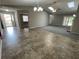 Large living room featuring beautiful flooring, natural light, and neutral paint scheme at 7123 Woodridge Ln, Union City, GA 30291
