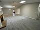 Spacious living room featuring cozy fireplace, new carpet and a vaulted ceiling with a skylight at 7123 Woodridge Ln, Union City, GA 30291