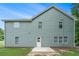 Backyard with a concrete patio and green siding at 2035 Stonebrook Dr, Austell, GA 30106