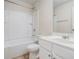 Bright bathroom featuring a white vanity, toilet, and a shower-tub combo with a white surround at 2035 Stonebrook Dr, Austell, GA 30106