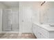 White bathroom features a glass enclosed shower, tile floor and double sink vanity at 2035 Stonebrook Dr, Austell, GA 30106