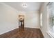 Open dining area featuring hardwood floors and natural light, with an open view to the kitchen at 2035 Stonebrook Dr, Austell, GA 30106