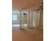 Bedroom with neutral carpet and curtains acting as a room divider at 2997 Happy Hollow Se Dr, Conyers, GA 30094